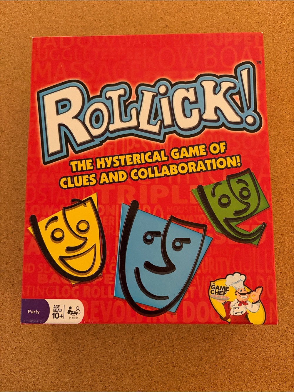 Rollick! Party Game by — Red Box with Blue, Yellow & Green Masks